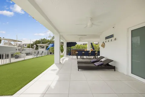 a living room with furniture and a garden