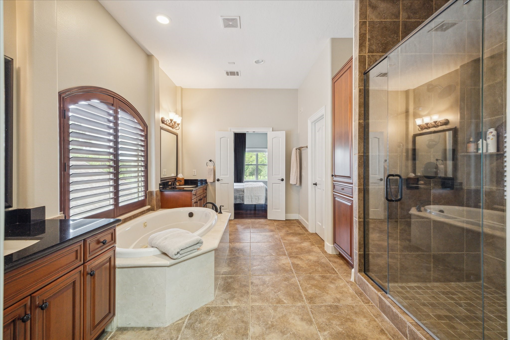 3319 Bridgeberry Lane Houston, TX 77082 - Photo 24 of 50 Second master suite bathroom with separate vanities, shower and soaking tub. Large walk in closet!