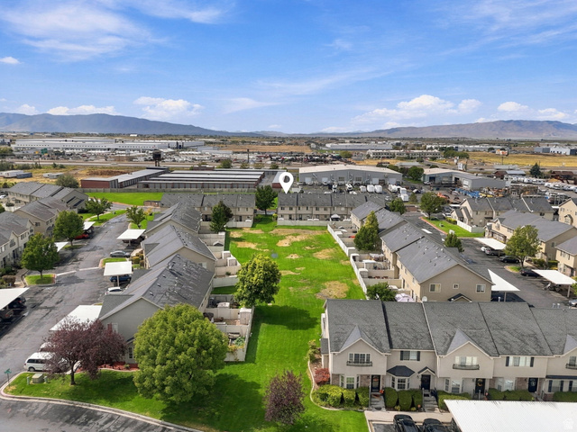 1041 South 1850th Street West Springville, UT 84663 - Photo 34 of 35 Townhome community featuring covered parking, mature trees, and mountain scenery