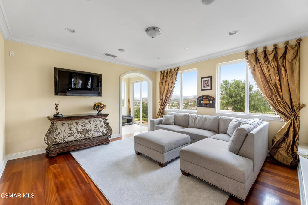 6717 Aspen Hills Drive Moorpark, CA 93021 - Photo 19 of 44 a living room with furniture and a flat screen tv