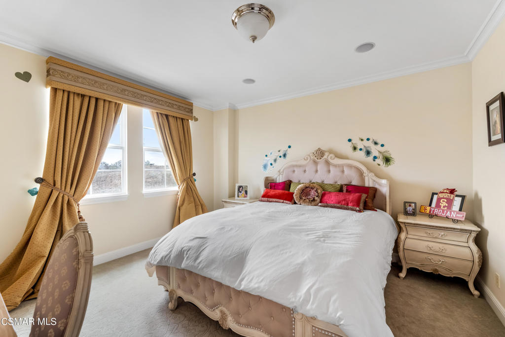 6717 Aspen Hills Drive Moorpark, CA 93021 - Photo 29 of 44 a bedroom with a bed and a window