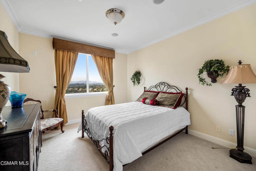 6717 Aspen Hills Drive Moorpark, CA 93021 - Photo 30 of 44 a bedroom with a bed and a window