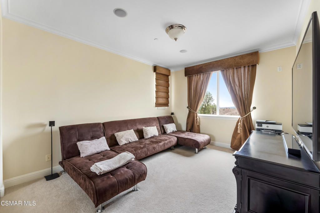 6717 Aspen Hills Drive Moorpark, CA 93021 - Photo 31 of 44 a living room with furniture and a window