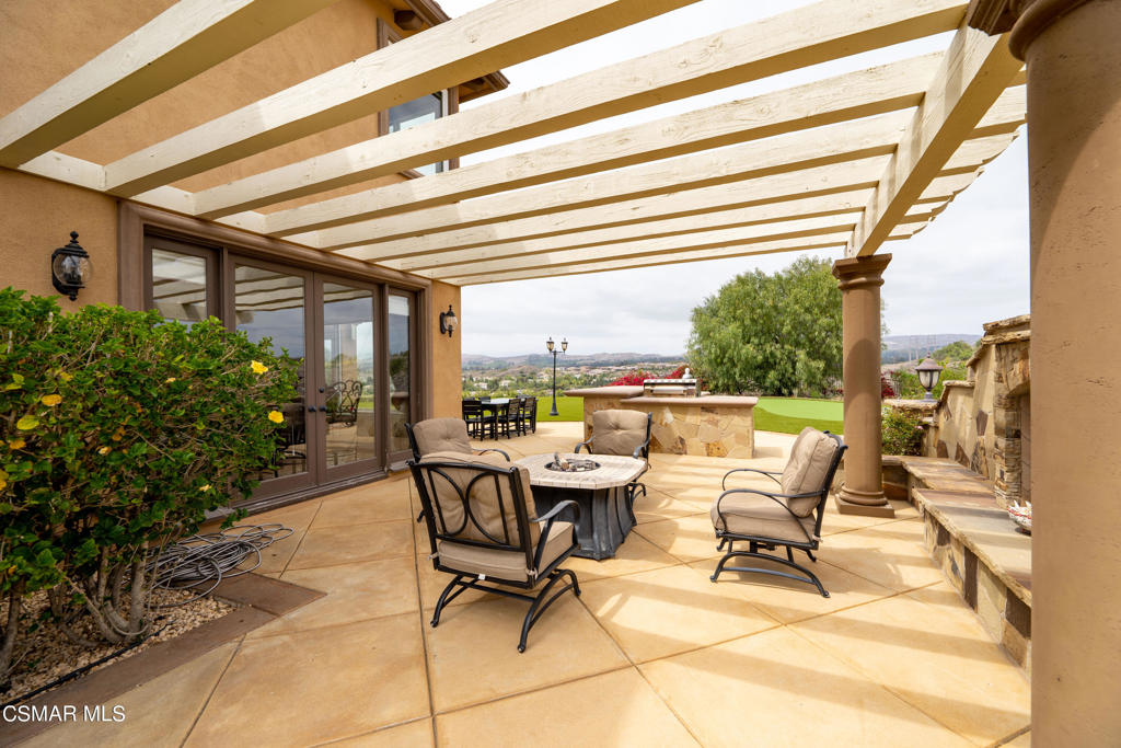 6717 Aspen Hills Drive Moorpark, CA 93021 - Photo 32 of 44 a building outdoor space with patio furniture and potted plants