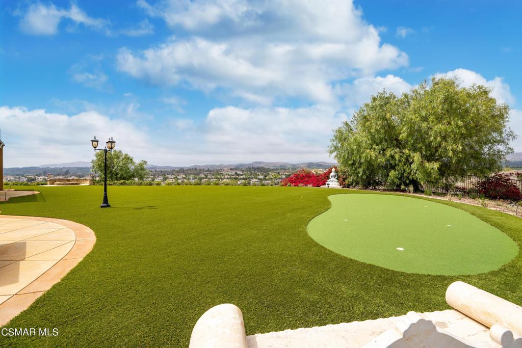 6717 Aspen Hills Drive Moorpark, CA 93021 - Photo 36 of 44 a view of a swimming pool with an outdoor space and seating area