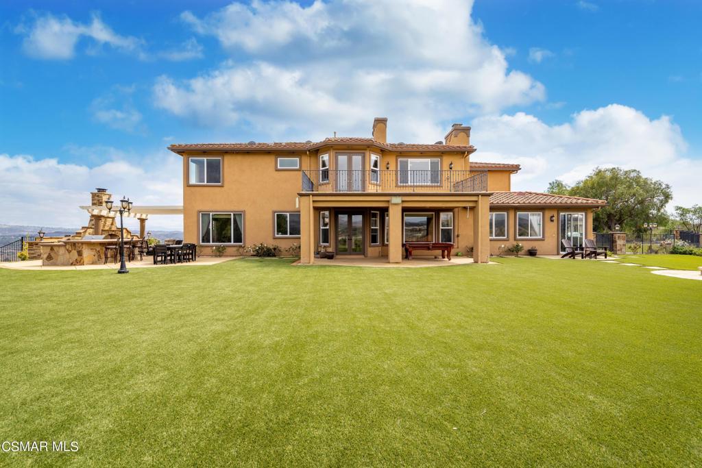 6717 Aspen Hills Drive Moorpark, CA 93021 - Photo 38 of 44 a front view of a building with swimming pool