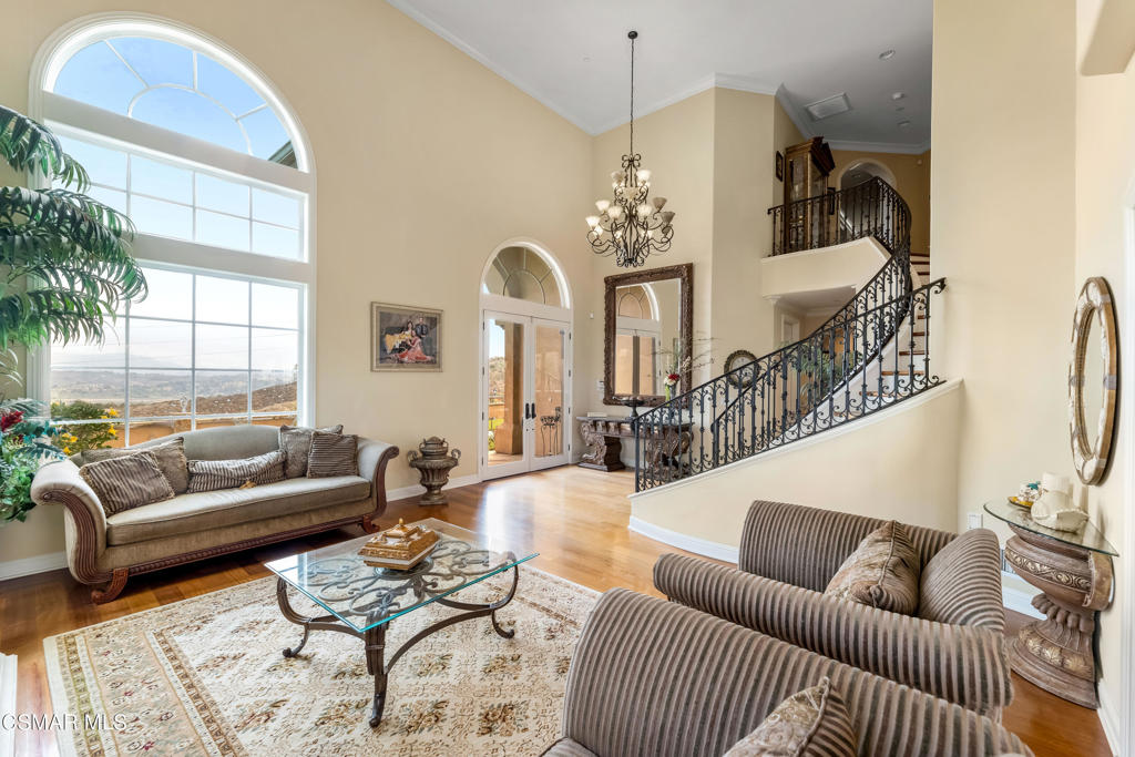 6717 Aspen Hills Drive Moorpark, CA 93021 - Photo 7 of 44 a living room with furniture and a chandelier