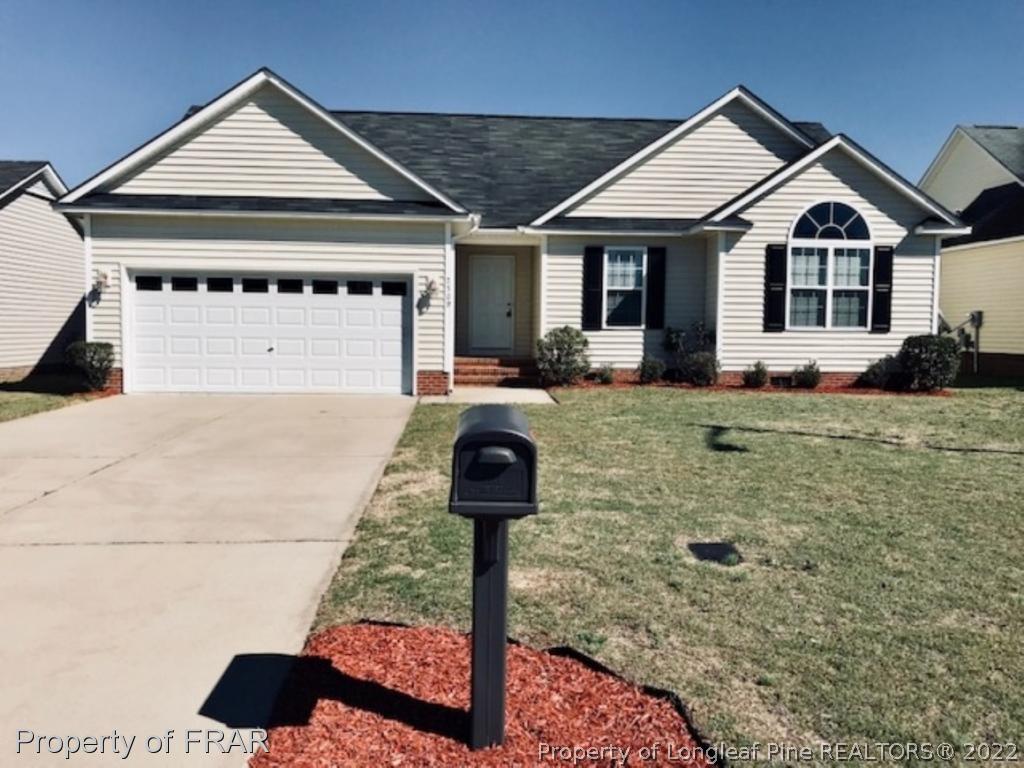 2309 Chasewater Road Fayetteville, NC 28306 - Photo 1 of 31 a front view of a house with yard