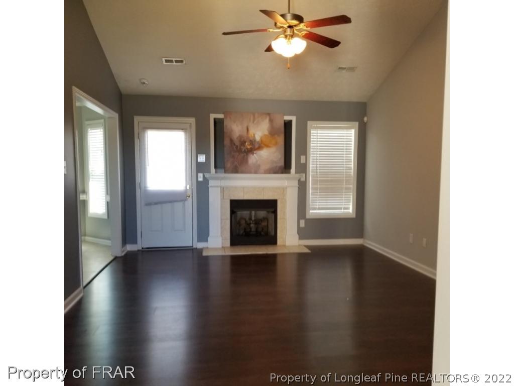 2309 Chasewater Road Fayetteville, NC 28306 - Photo 2 of 31 a view of an empty room with wooden floor and a window