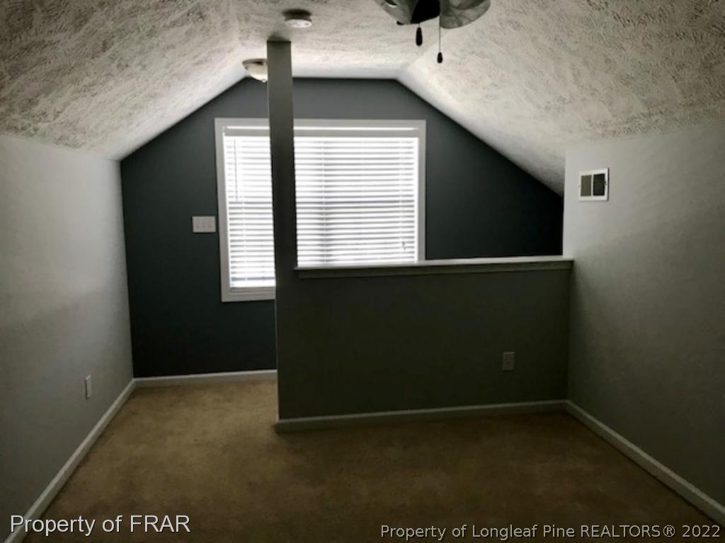 2309 Chasewater Road Fayetteville, NC 28306 - Photo 22 of 31 a view of an empty room with a window