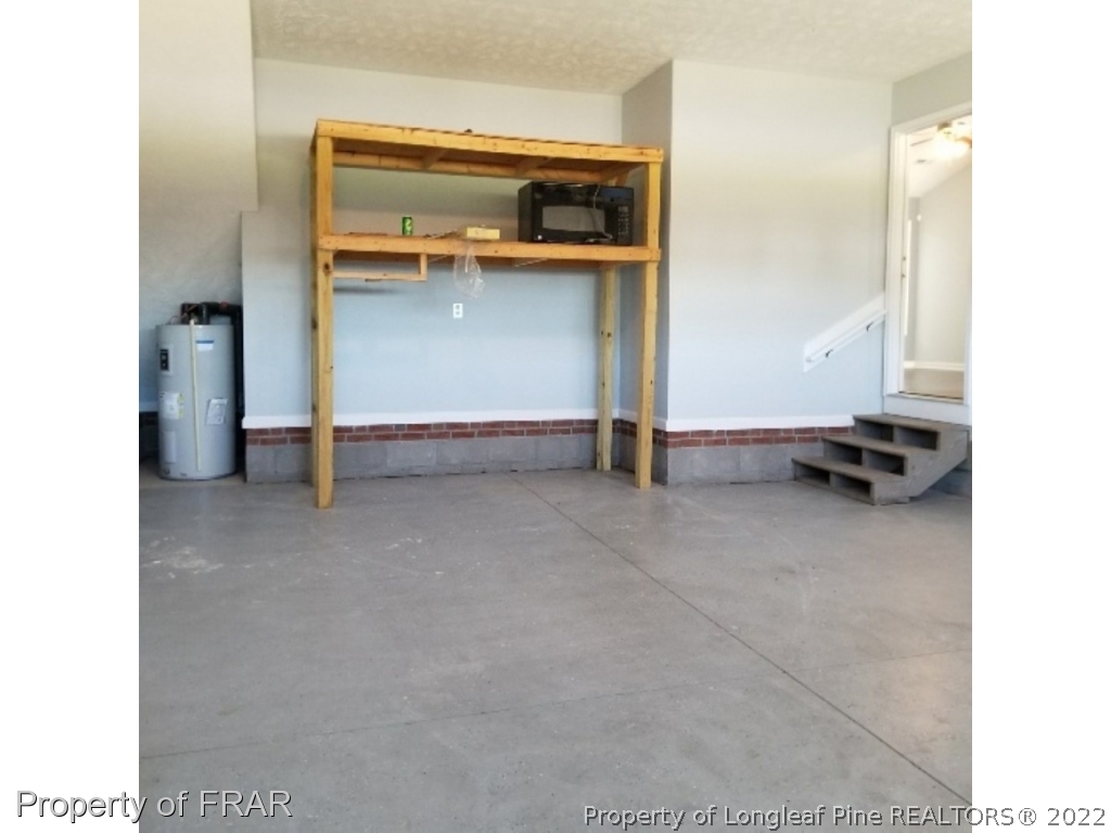 2309 Chasewater Road Fayetteville, NC 28306 - Photo 25 of 31 a view of an empty room and fire place