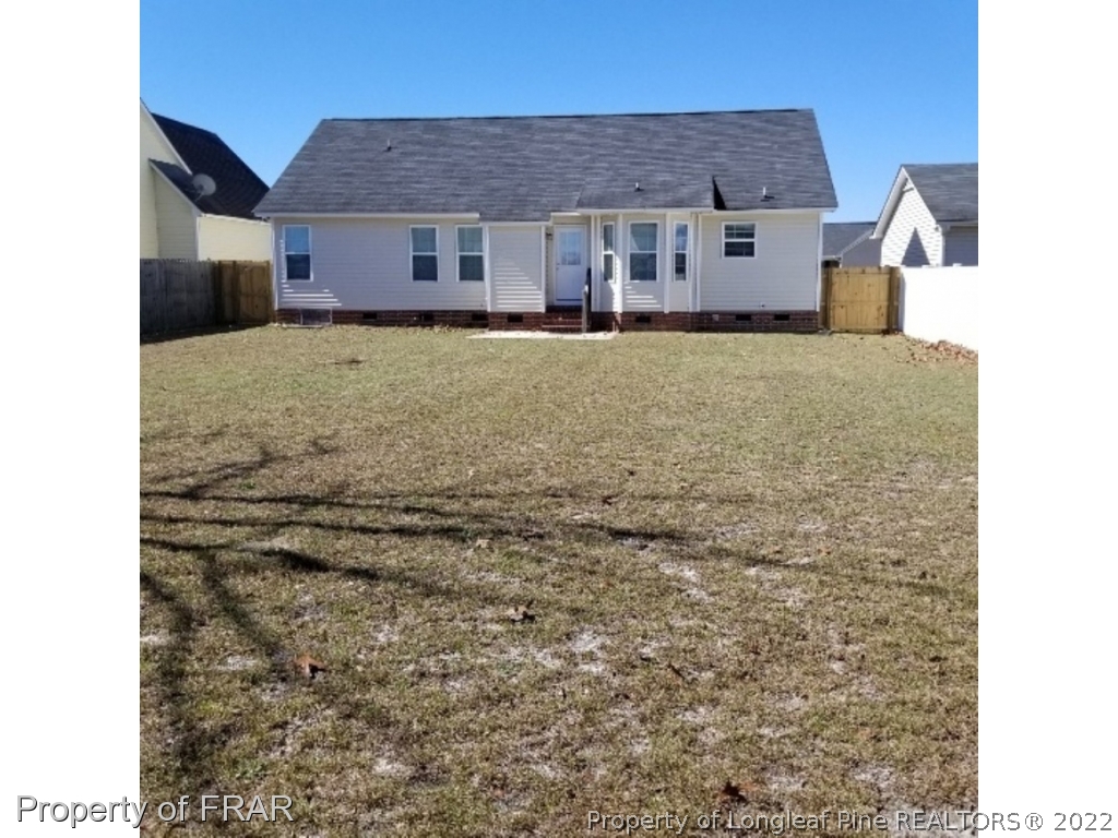 2309 Chasewater Road Fayetteville, NC 28306 - Photo 29 of 31 a view of a house with a yard