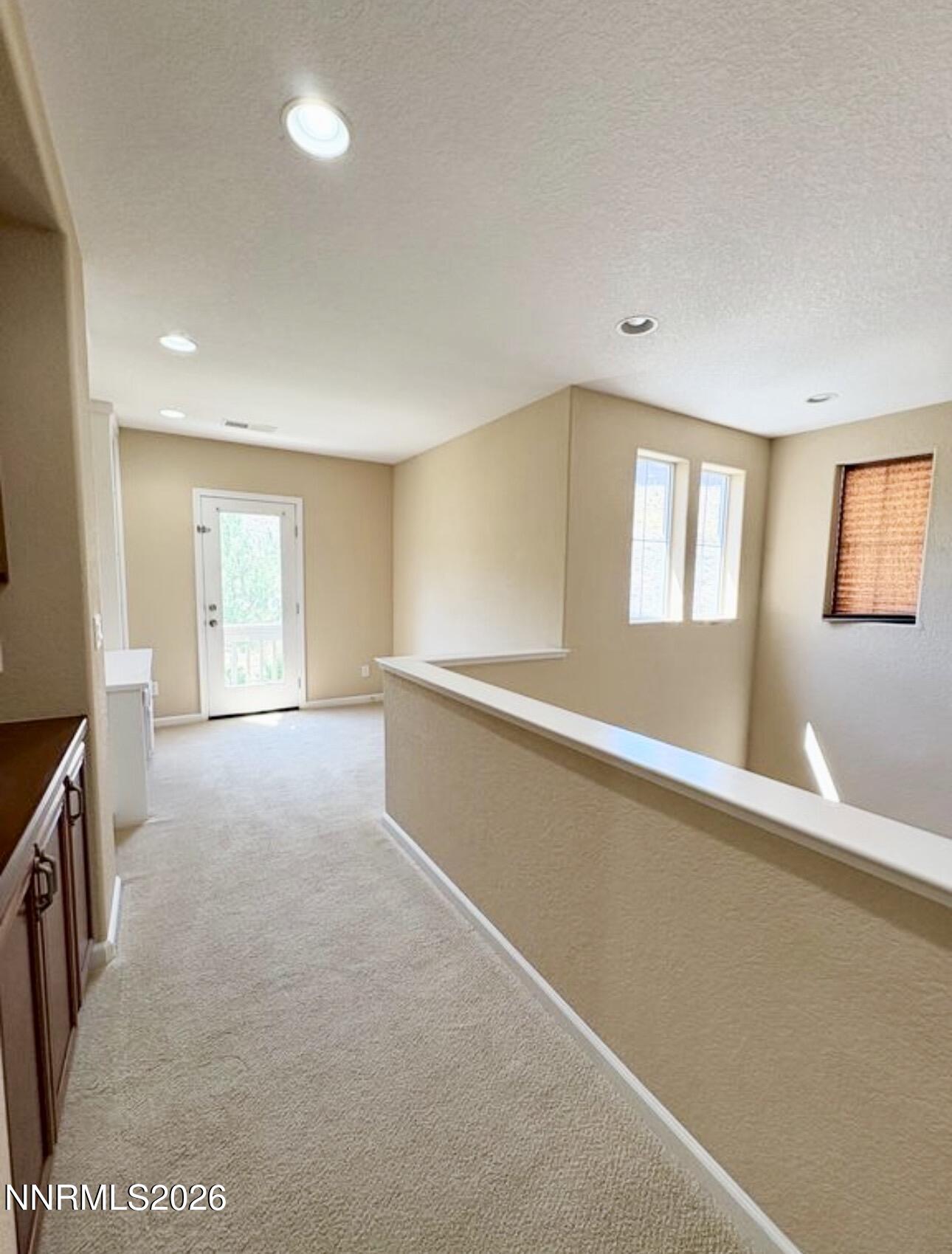 7616 Stone Bluff Way Reno, NV 89523 - Photo 7 of 18 a view of an empty room with a window