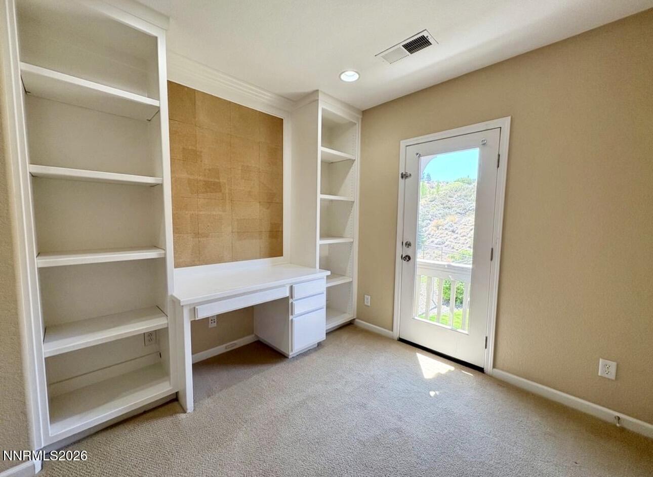 7616 Stone Bluff Way Reno, NV 89523 - Photo 8 of 18 a view of an empty room with a window