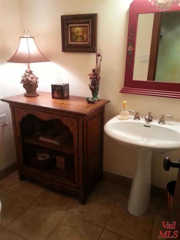 950 Red Sandstone Road, Unit 26 Vail, CO 81657 - Photo 12 of 23 Powder room off the entry.