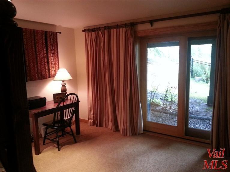 950 Red Sandstone Road, Unit 26 Vail, CO 81657 - Photo 21 of 23 Third bedroom also offers yard access an