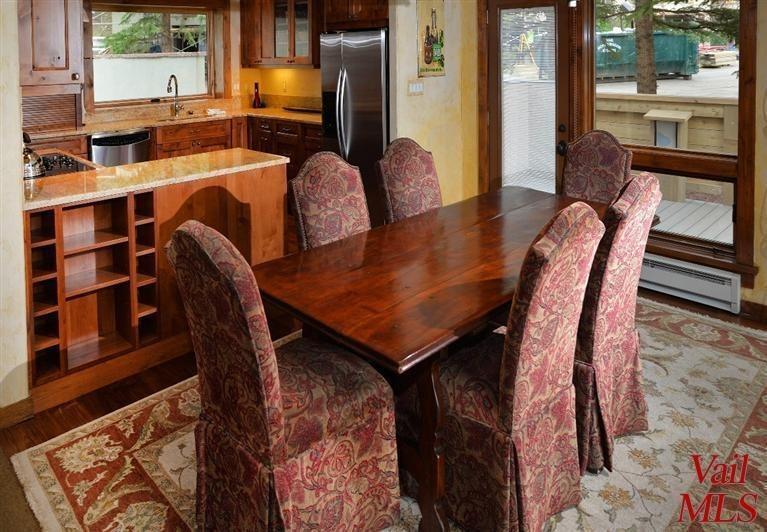 950 Red Sandstone Road, Unit 26 Vail, CO 81657 - Photo 9 of 23 Dining room borders the kitchen, living