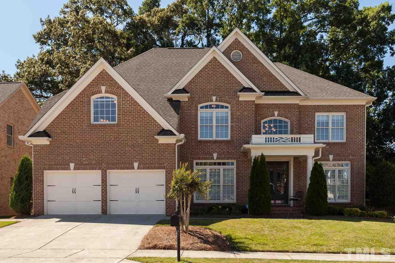 11825 Lowery Ridge Drive Raleigh, NC 27614 - Photo 1 of 25 a front view of a house with garden