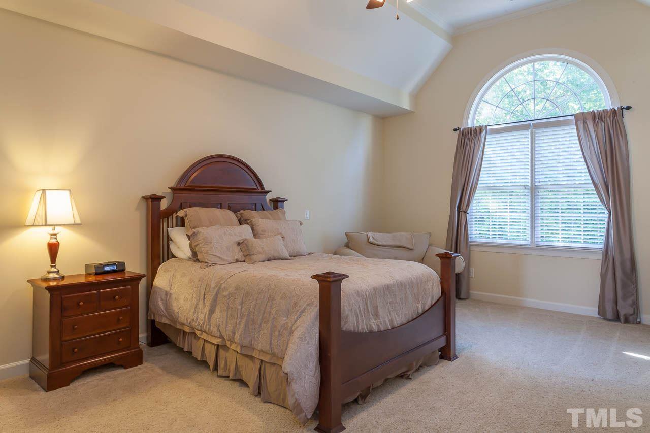 11825 Lowery Ridge Drive Raleigh, NC 27614 - Photo 12 of 25 a bedroom with a bed and a window
