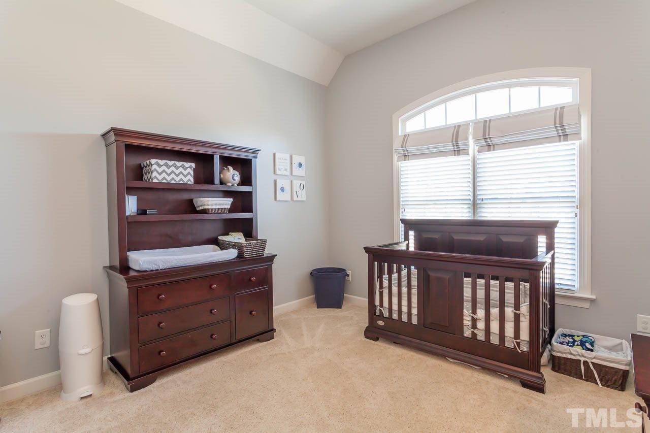 11825 Lowery Ridge Drive Raleigh, NC 27614 - Photo 19 of 25 a bedroom with a bed and a window