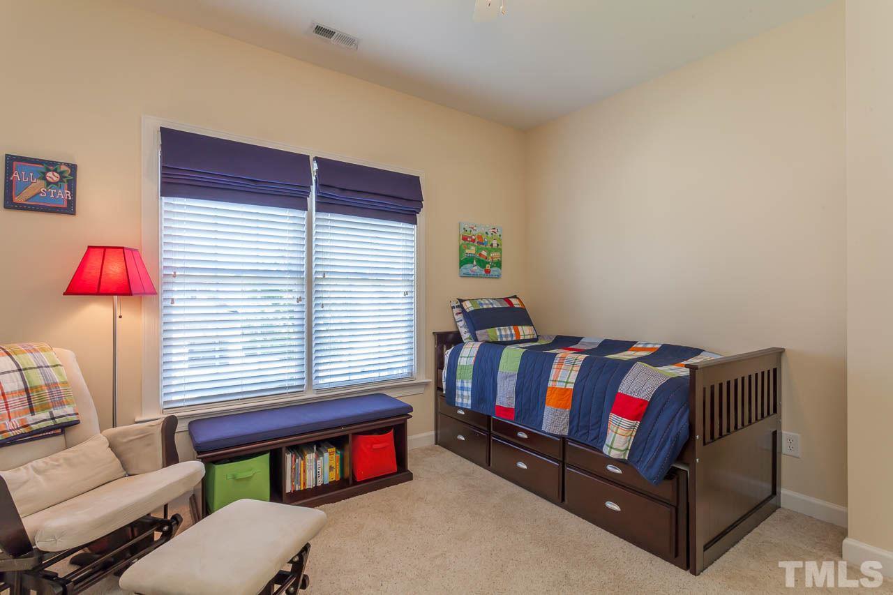 11825 Lowery Ridge Drive Raleigh, NC 27614 - Photo 21 of 25 a bedroom with furniture and a window