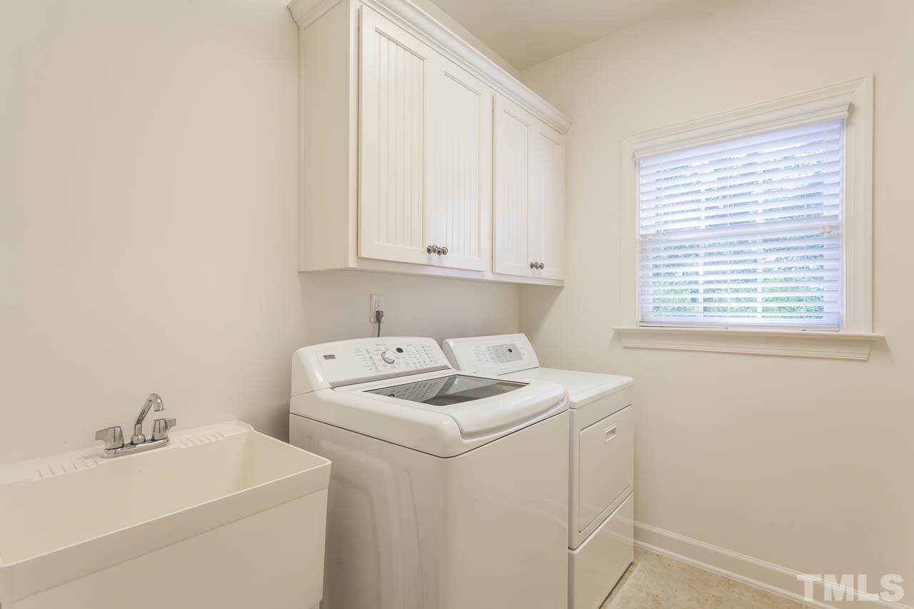 11825 Lowery Ridge Drive Raleigh, NC 27614 - Photo 23 of 25 a utility room with dryer and washer