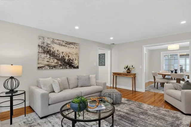 a living room with furniture and a table