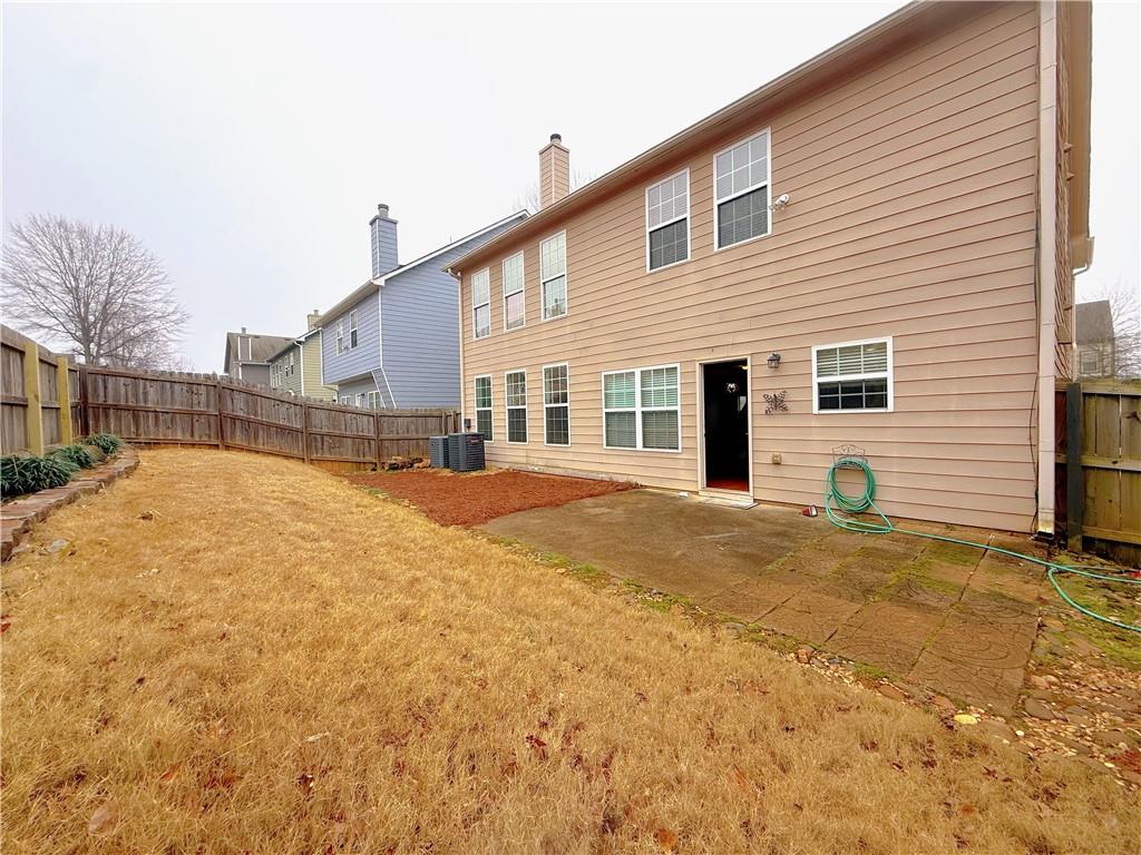 5691 Apple Grove Road Northeast Buford, GA 30519 - Photo 23 of 23 a view of a house with snow on the road