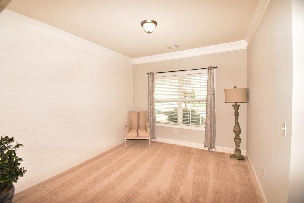5691 Apple Grove Road Northeast Buford, GA 30519 - Photo 7 of 23 a view of an empty room with a window