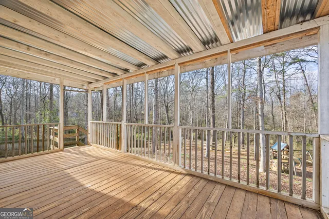 a view of a balcony with wooden floor