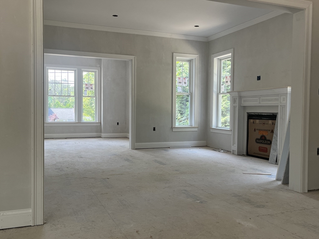 485 Main Street Millis, MA 02054 - Photo 15 of 31 a view of empty room with windows and fireplace