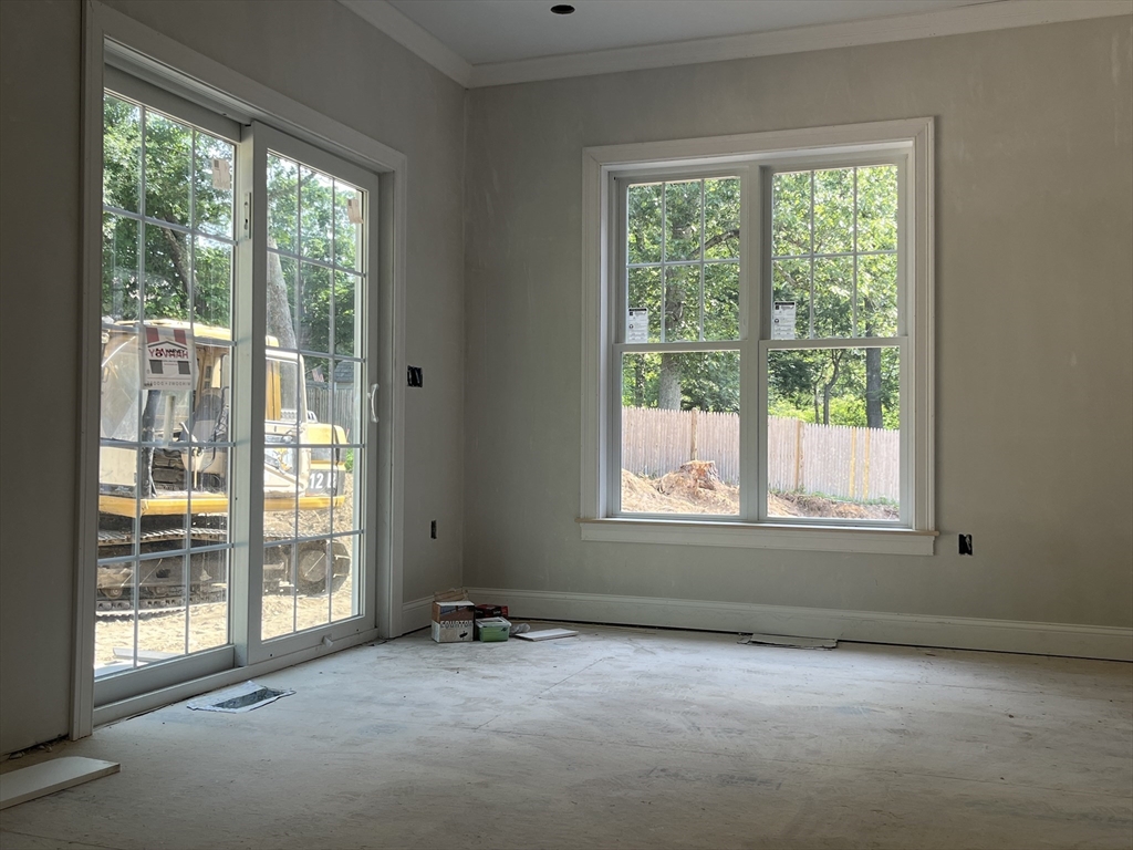 485 Main Street Millis, MA 02054 - Photo 20 of 31 a view of an empty room with a window