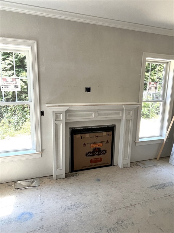 485 Main Street Millis, MA 02054 - Photo 2 of 31 a living room with a fireplace and windows