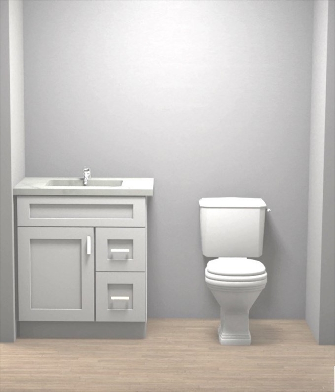 485 Main Street Millis, MA 02054 - Photo 25 of 31 a bathroom with a toilet a sink and mirror