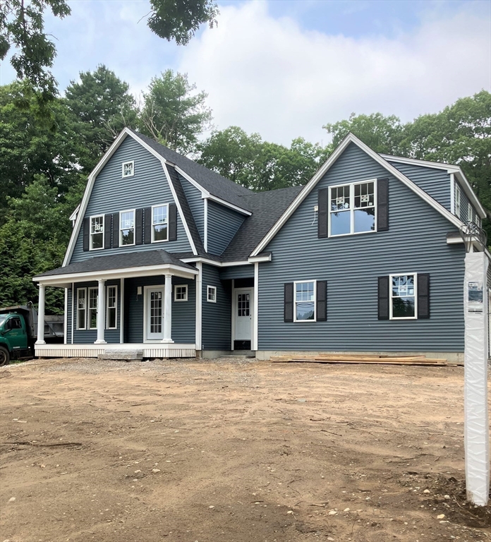 485 Main Street Millis, MA 02054 - Photo 26 of 31 a house with trees in the background