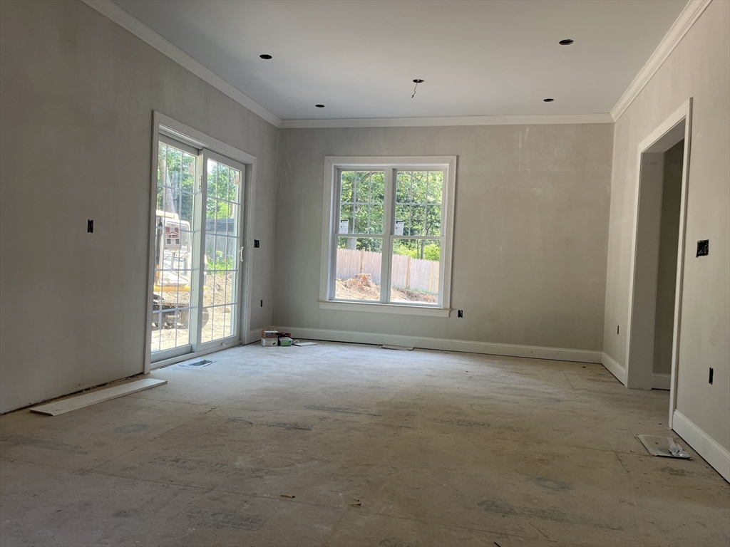485 Main Street Millis, MA 02054 - Photo 10 of 31 a view of an empty room with a window