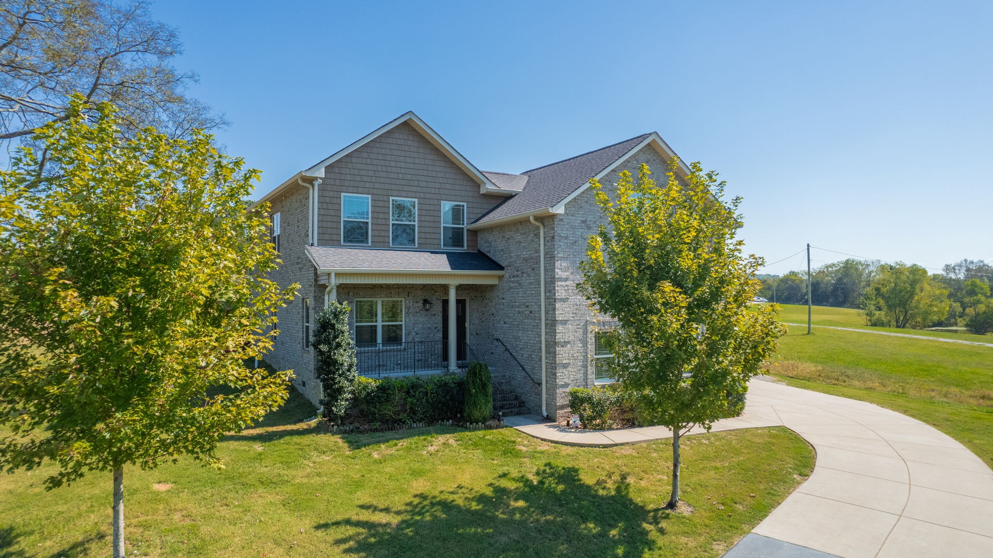 2155 Turner Road Watertown, TN 37184 - Photo 1 of 49 a front view of a house with garden