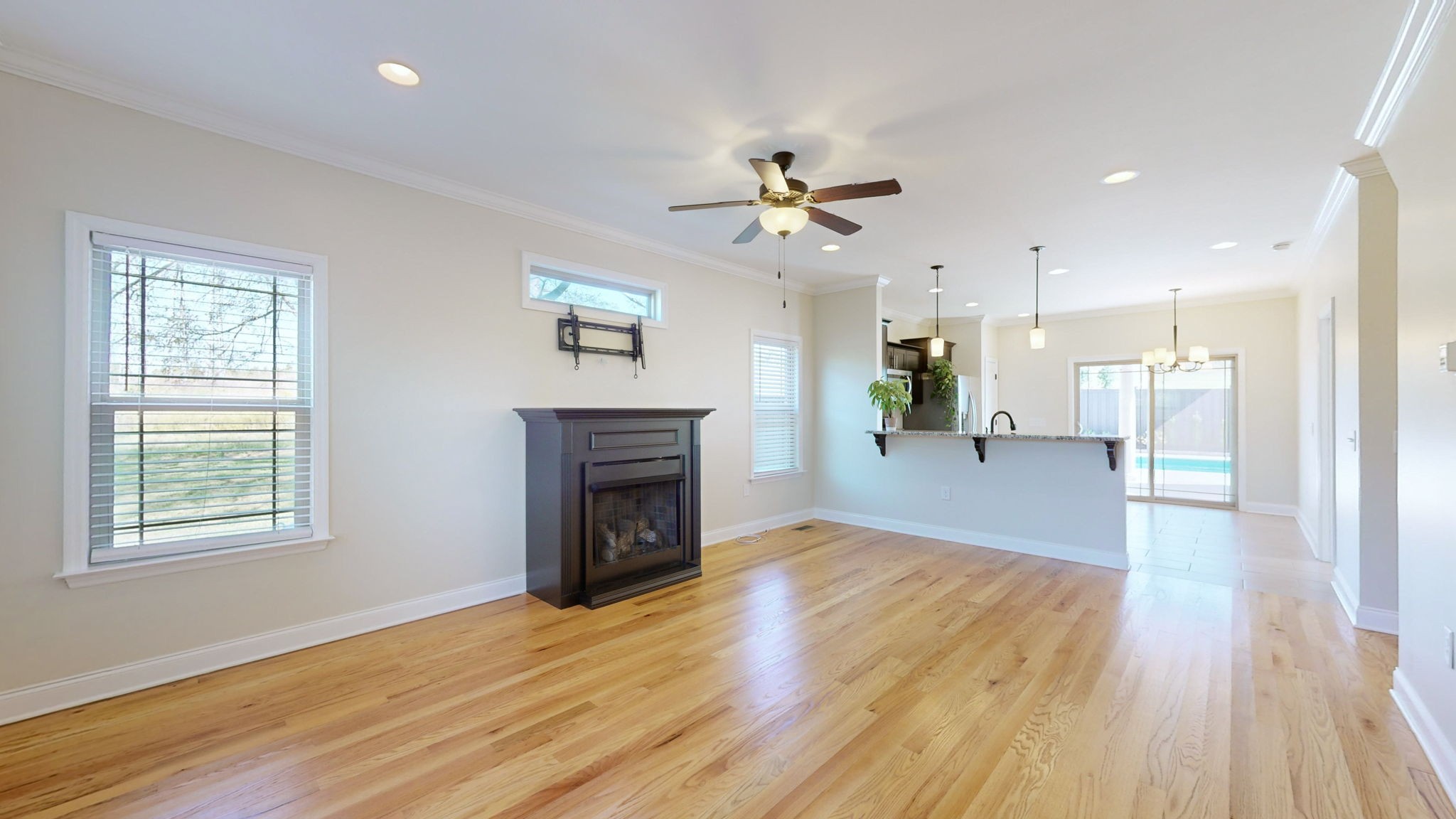 2155 Turner Road Watertown, TN 37184 - Photo 2 of 49 a view of a livingroom with a fireplace a ceiling fan and wooden floor