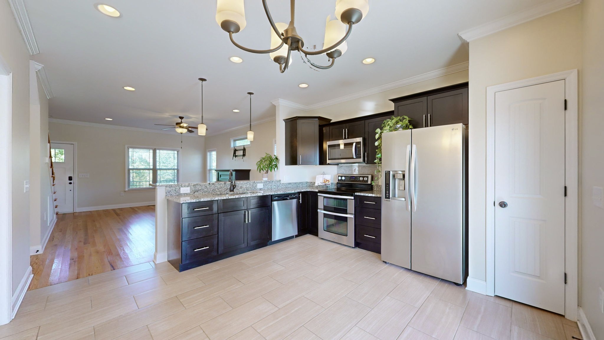 2155 Turner Road Watertown, TN 37184 - Photo 8 of 49 a large kitchen with stainless steel appliances kitchen island granite countertop a refrigerator a stove a sink and a oven