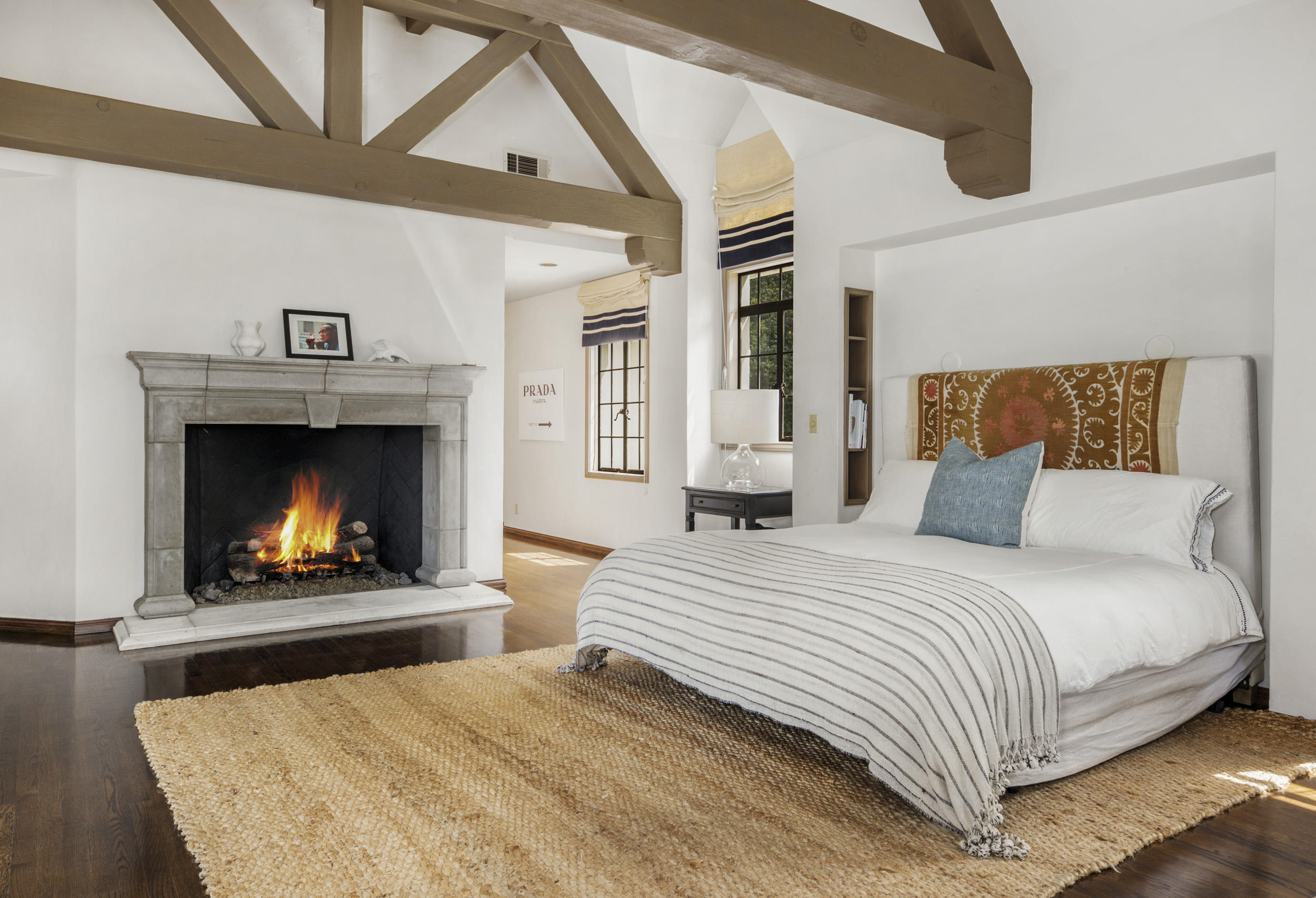 165 Middle Road Santa Barbara, CA 93108 - Photo 27 of 38 a bedroom with a bed and a fireplace