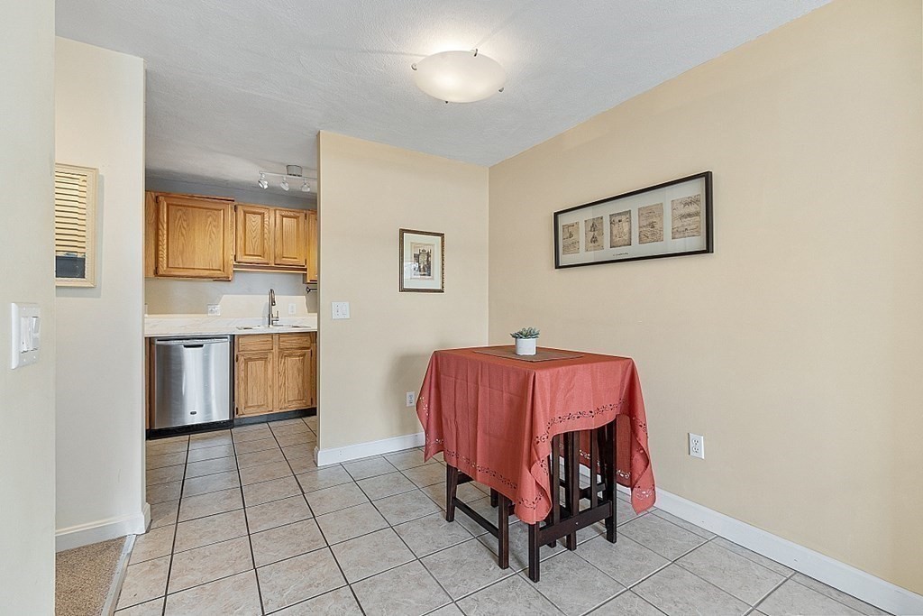 205 Great Road, Unit C1 Acton, MA 01720 - Photo 3 of 18 a living room with a sink and cabinets