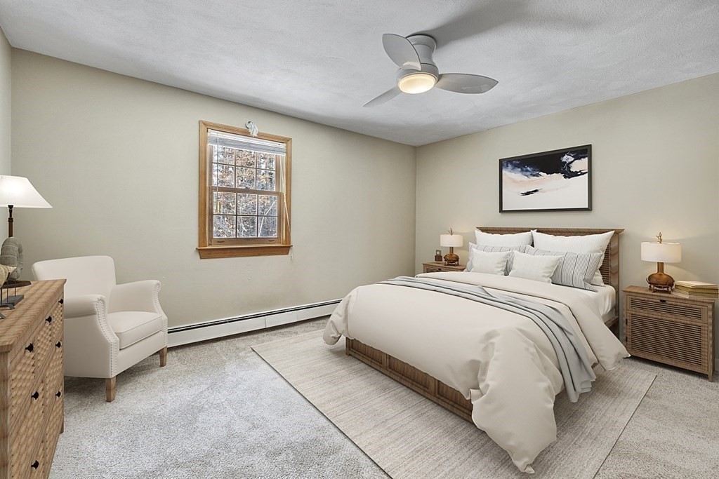 205 Great Road, Unit C1 Acton, MA 01720 - Photo 8 of 18 a bedroom with bed and a chandelier