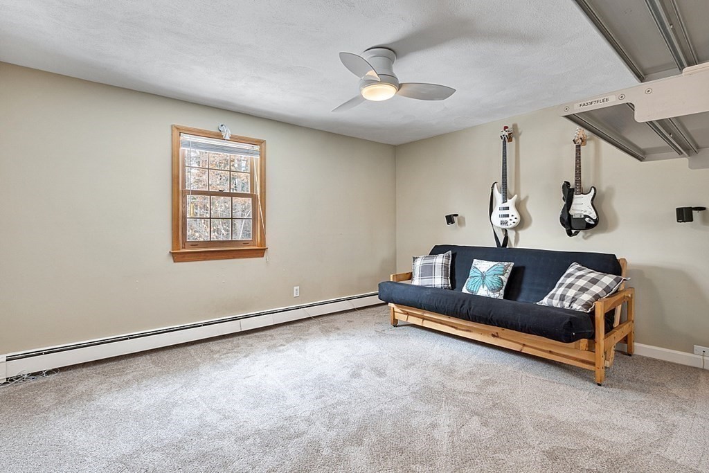 205 Great Road, Unit C1 Acton, MA 01720 - Photo 9 of 18 a living room with furniture and a window