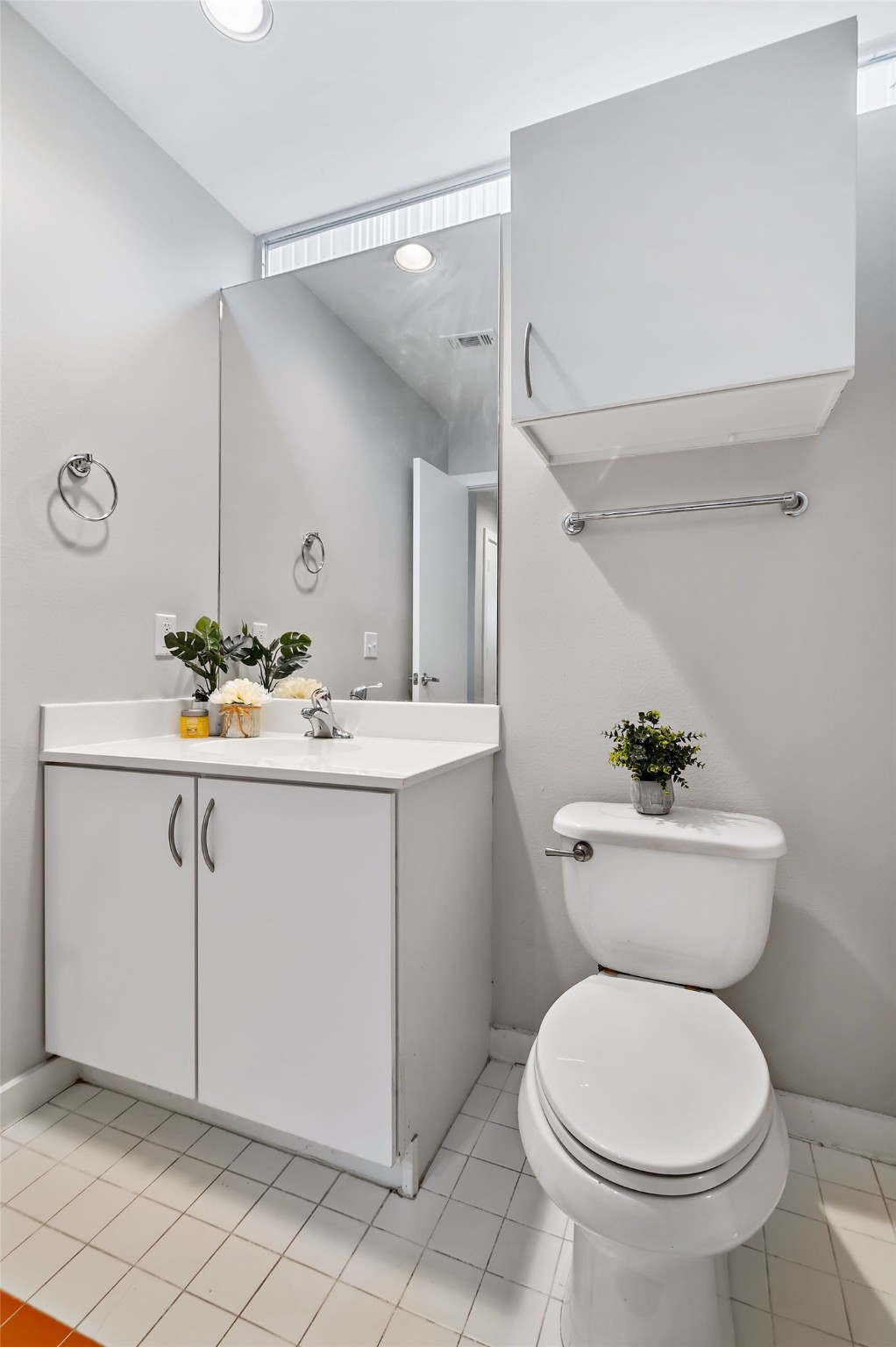 2605 Calumet Street, Unit 34 Houston, TX 77004 - Photo 12 of 37 a bathroom with a sink mirror vanity and toilet