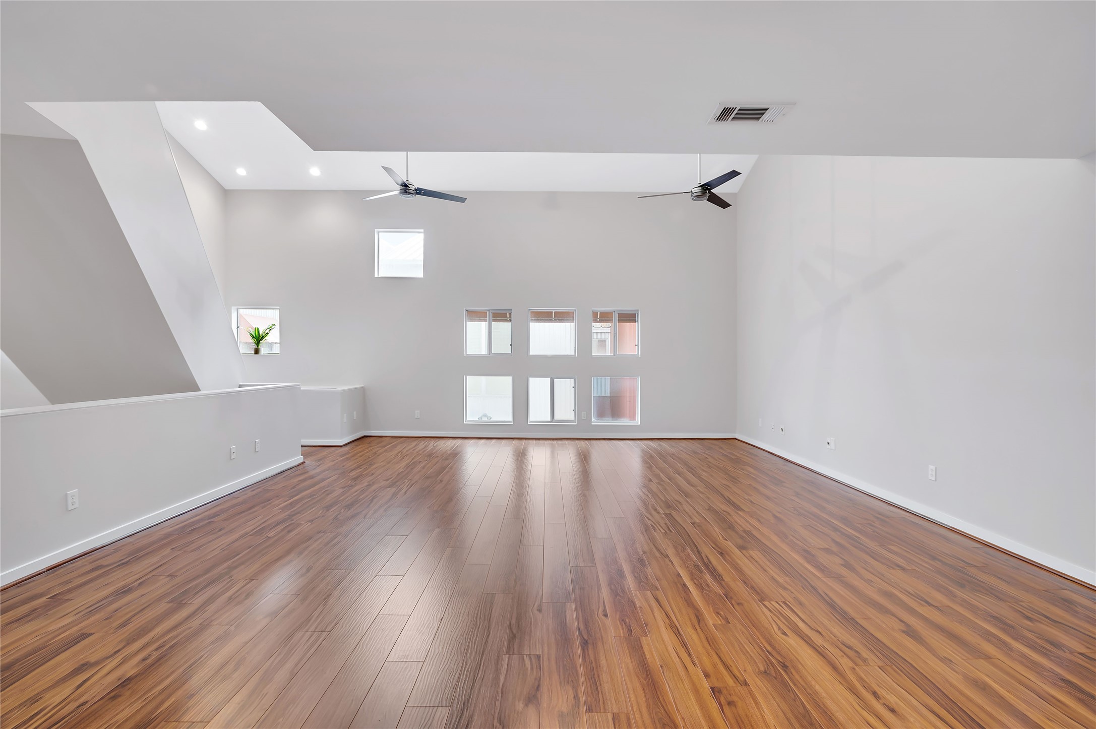 2605 Calumet Street, Unit 34 Houston, TX 77004 - Photo 15 of 37 a view of an empty room with wooden floor and a window