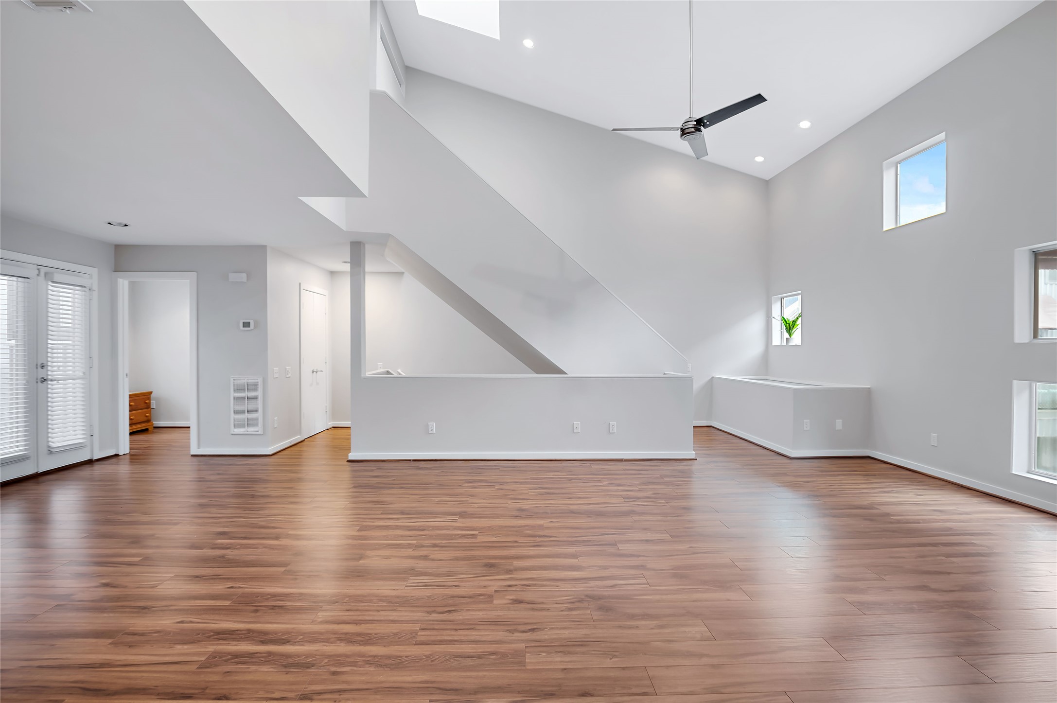 2605 Calumet Street, Unit 34 Houston, TX 77004 - Photo 16 of 37 a view of an empty room with wooden floor and a window
