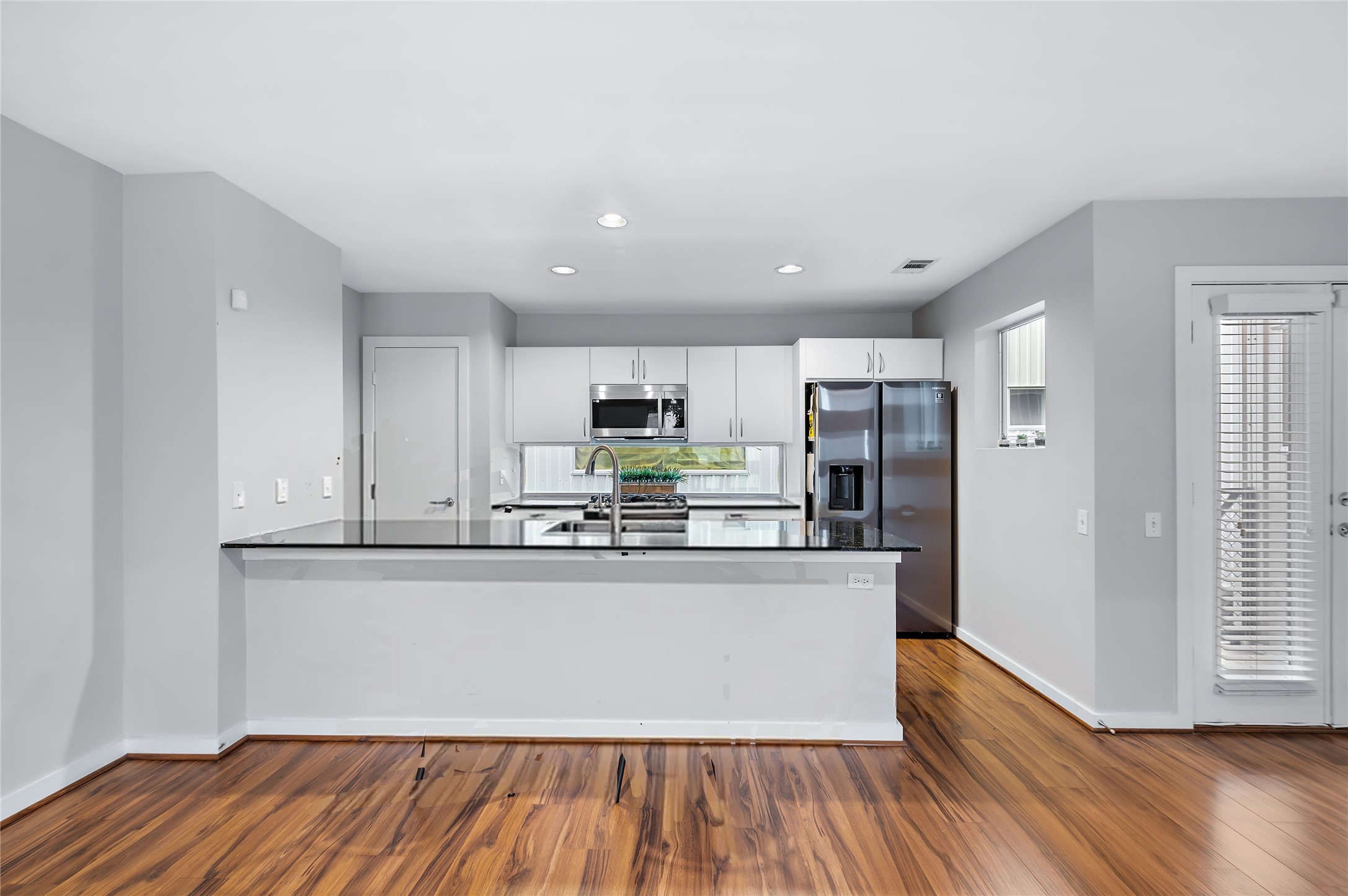 2605 Calumet Street, Unit 34 Houston, TX 77004 - Photo 21 of 37 a kitchen with stainless steel appliances a refrigerator and a stove top oven
