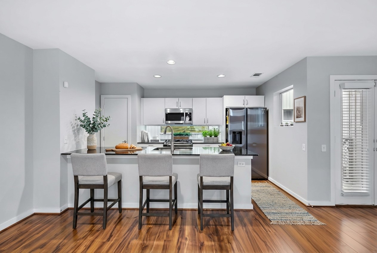 2605 Calumet Street, Unit 34 Houston, TX 77004 - Photo 22 of 37 a view of a dining room with furniture window and wooden floor