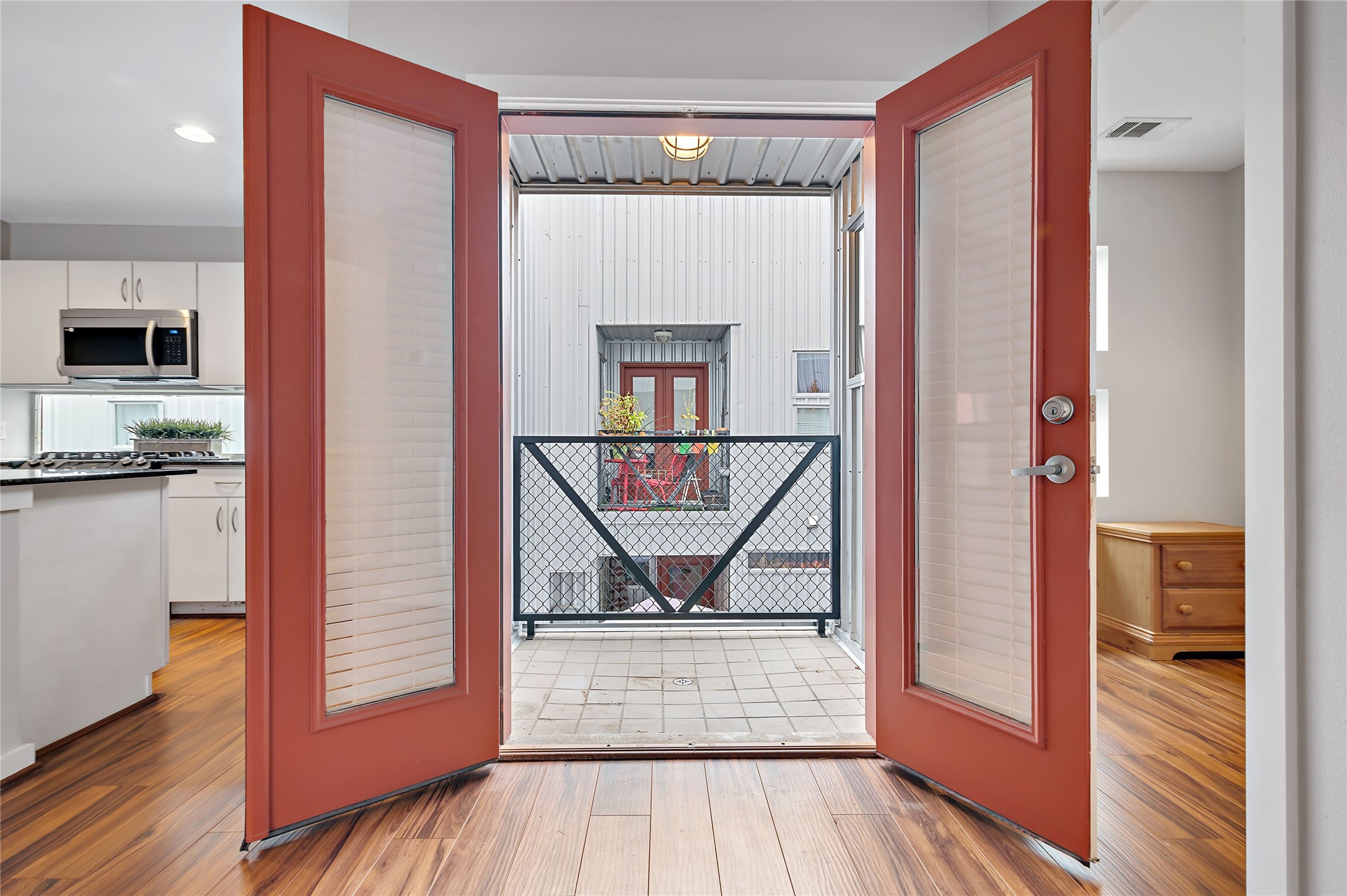2605 Calumet Street, Unit 34 Houston, TX 77004 - Photo 24 of 37 a view of a hallway with wooden floor and a living room