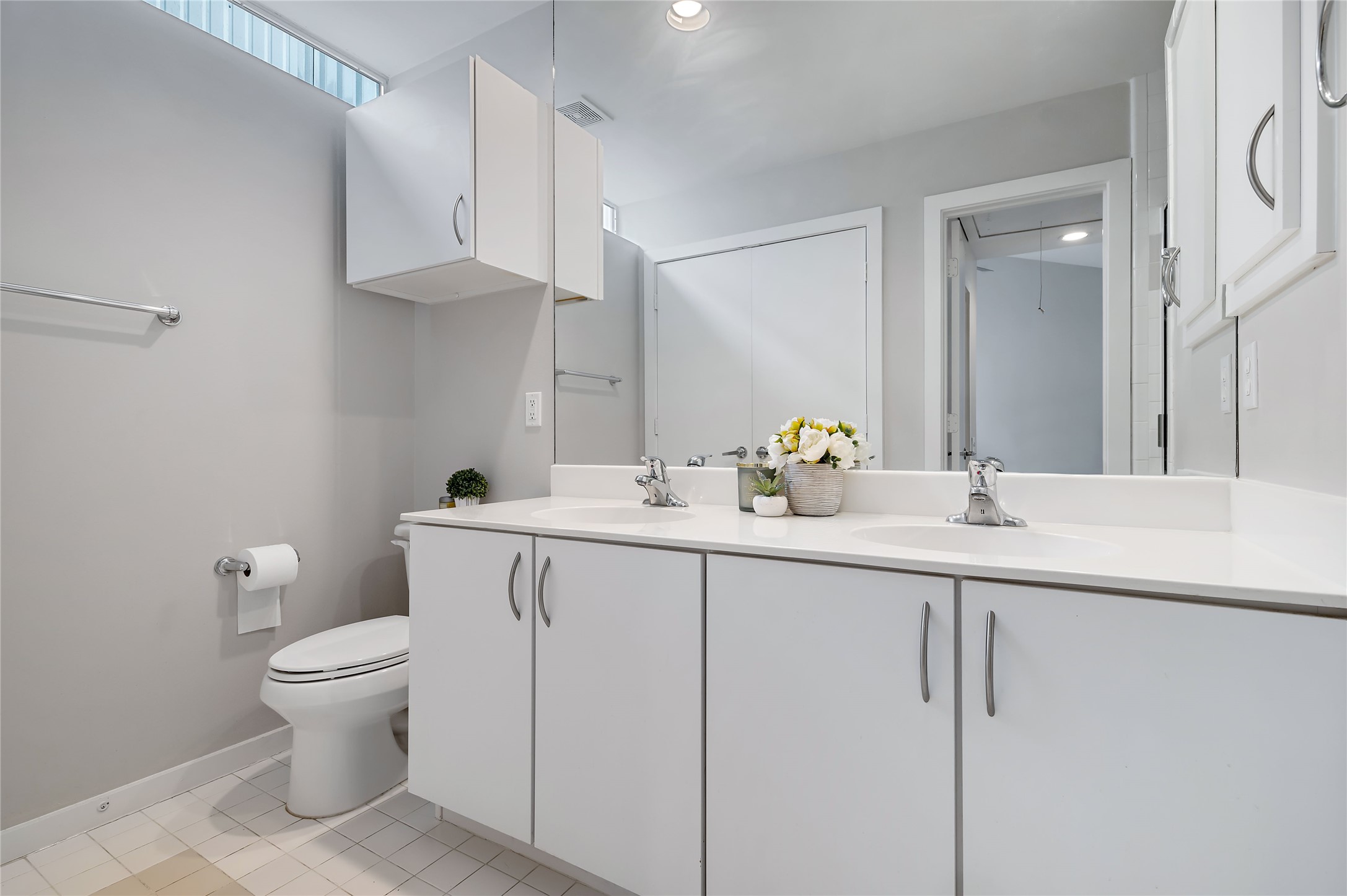 2605 Calumet Street, Unit 34 Houston, TX 77004 - Photo 32 of 37 a bathroom with a sink a toilet and a mirror